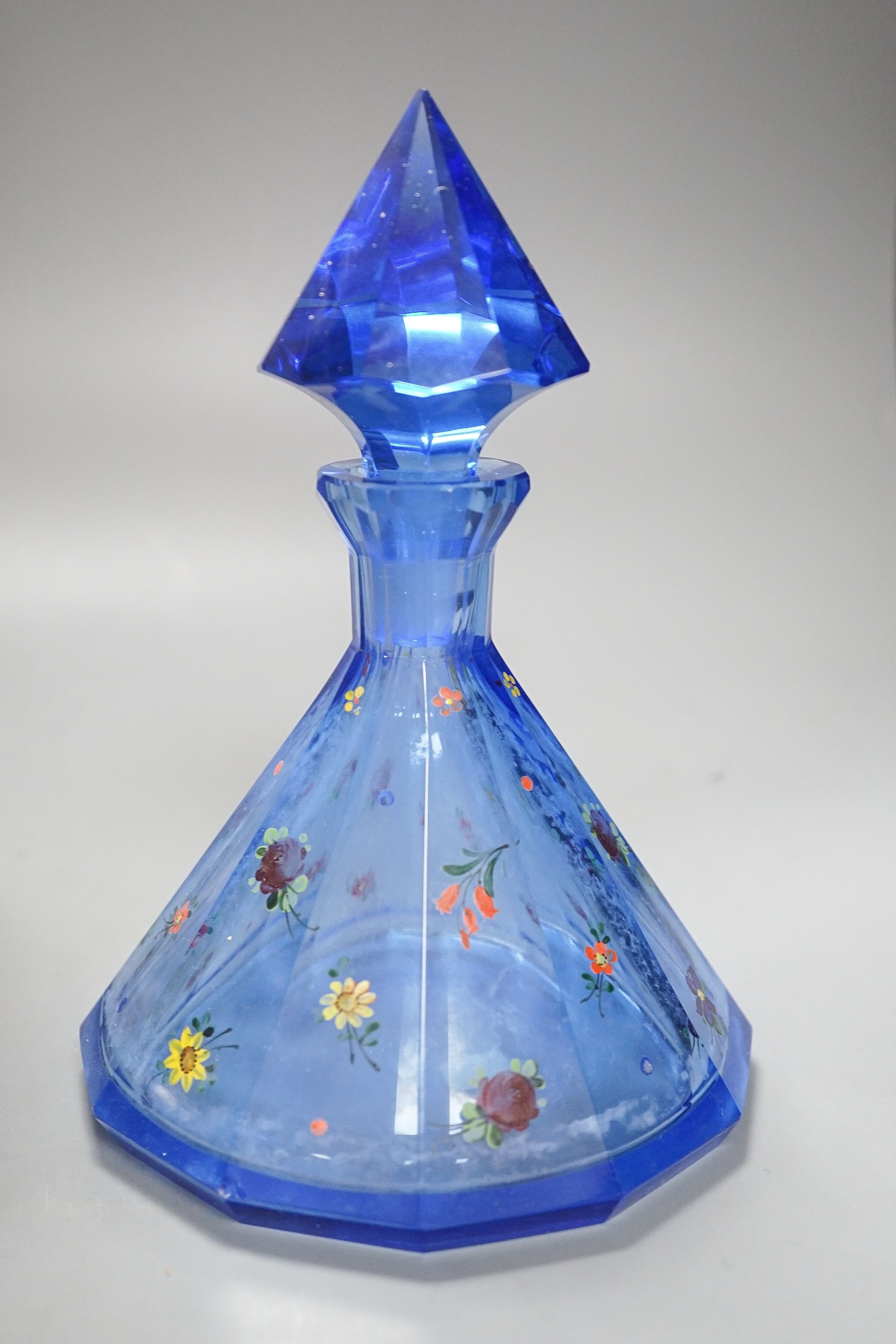 An American novelty dog decanter, silver topped perfume bottle, blue perfume bottle and three candy stripe bottles 32cm